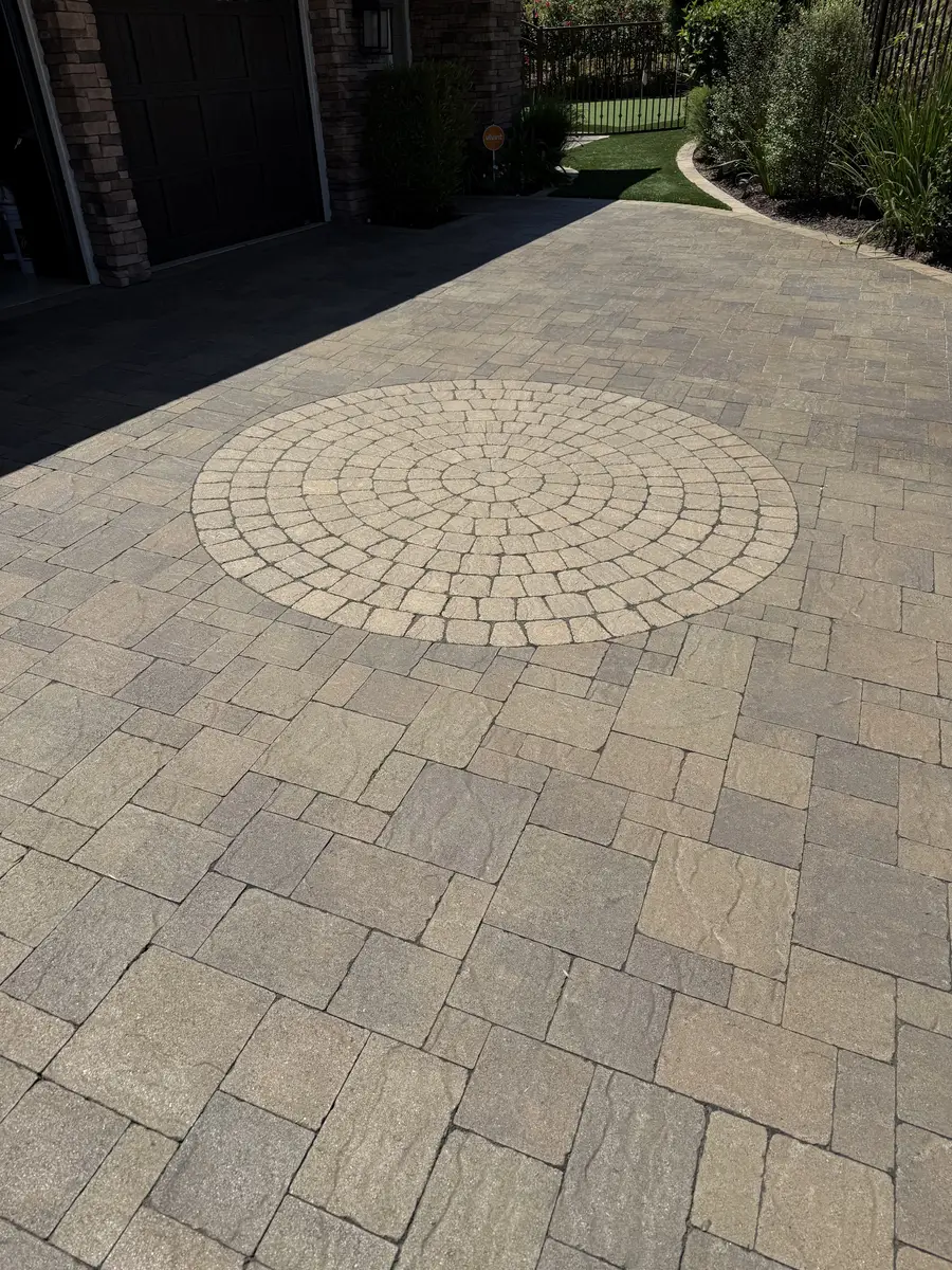 Paver driveway with decorative circular inlay pattern