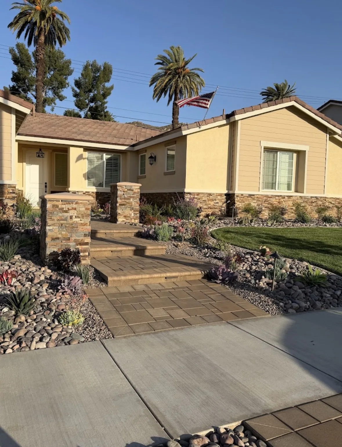 Paver steps and walkway with rock garden front yard