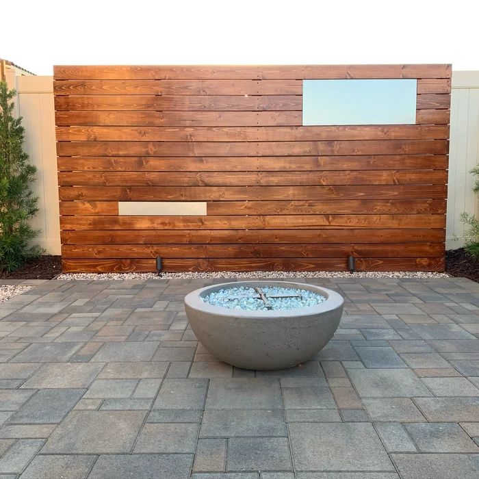 Modern water bowl fountain and paver patio by Valley Pacific Landscape